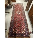 20th cent. Persian runner, red ground with one central Gul and three borders, all decorated with