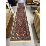 20th cent. Runner, Asian style predominantly in red hues with striking blues and greens and