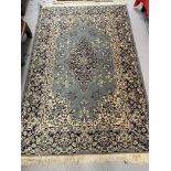 20th cent. Kashgar or S.W. Chinese, blue ground with a central Gul decorated with floral designs