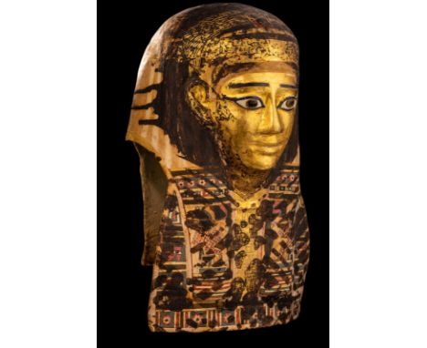 An Egyptian Gilt Cartonnage Mummy MaskPtolemaic Period, 304-30 B.C.Height 18 1/2 inches (47 cm).Provenance: Henri Smeets, Wee