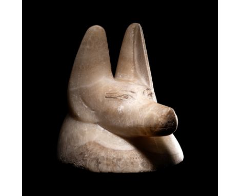 An Egyptian Alabaster Head of a JackalLate Period, 26th-30th Dynasty, 664-525 B.C.Height 6 inches (15.2 cm).Provenance:Privat