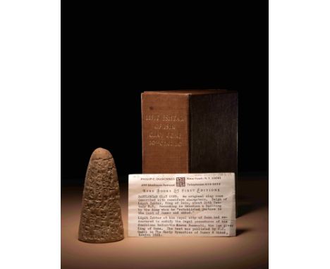 An Akkadian Cuneiform Foundation Cone&nbsp;Mesopotamia, King of Isin, Circa 1934-1924 B.C.Height 4 1/2 inches (11.43 cm).Prov