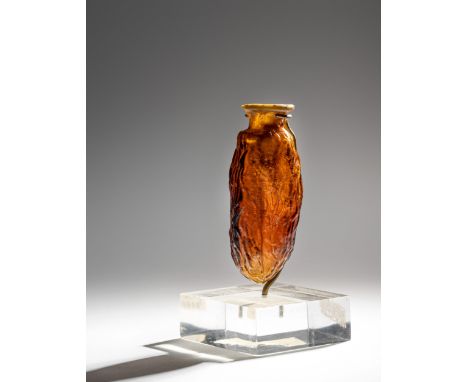 A Roman Amber Glass Date Flask&nbsp;Circa 1st-2nd Century A.D.Height 3 inches (8 cm).Collection from an Important Midwestern 