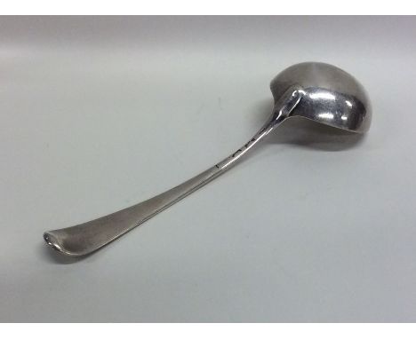 A Georgian silver OE pattern sauce ladle with crested terminal. Approx. 65 grams. Est. £25 - £35.