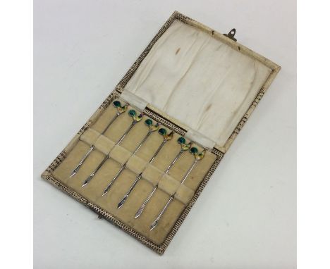 A cased set of six silver and enamel cocktail sticks. Birmingham. By AS. Est. £60 - £80.