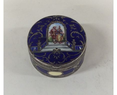 A Continental silver and enamel pill box decorated with a romantic scene and hinged lid. Approx. 72 grams. Est. £80 - £100.