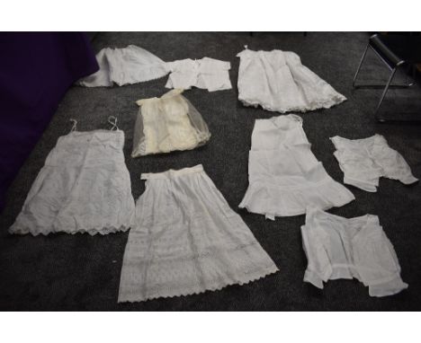 A collection of Victorian petticoats and similar, also a 1950s blouse and a childrens gown in fine tulle.