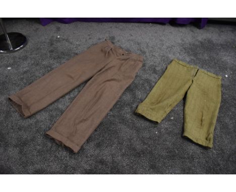 A pair of gents wool trousers with turn ups and button fly, and a pair of green tweed knee britches.