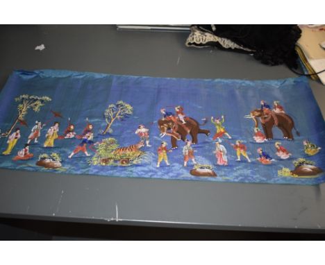 A vintage silk panel having painted Indian scenes.