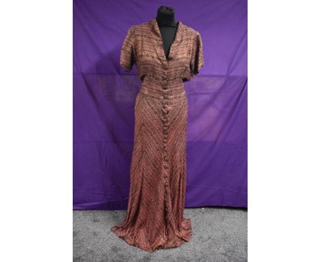 A late 1930s/ early 1940s pink and black evening gown having metallic copper thread running throughout, self covered button f