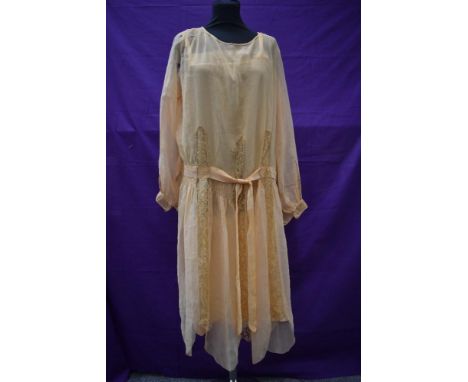 An early 20th century sheer apricot dress and a matching silk slip,with lace panel detailing to dress.AF.