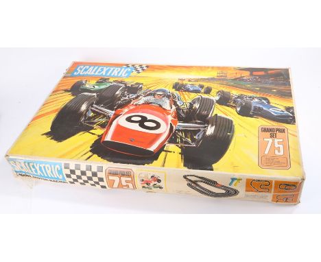 Scalextric Grand Prix set 75, housed in original boxOne controller and one car missing, remaining Lotus C/8 Indianapolis car 