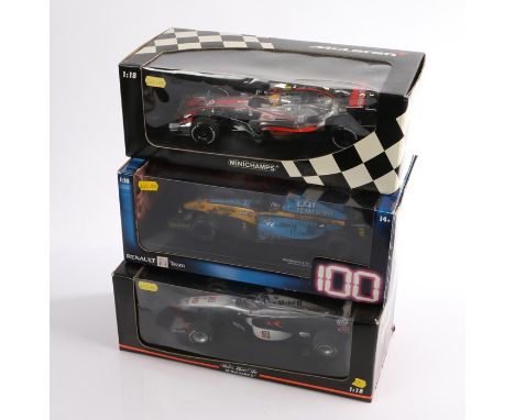 Three Formula One model vehicles, all boxed, 1:18 scale, consisting of one Hot Wheels Renault and two Minichamps Mclarens (3)