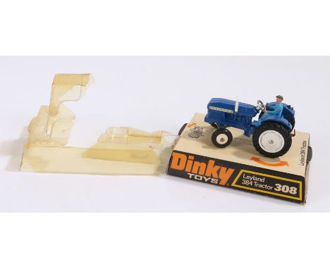 Dinky No. 308 Leyland 384 Tractor in blue with driver, boxed but damaged bubble 