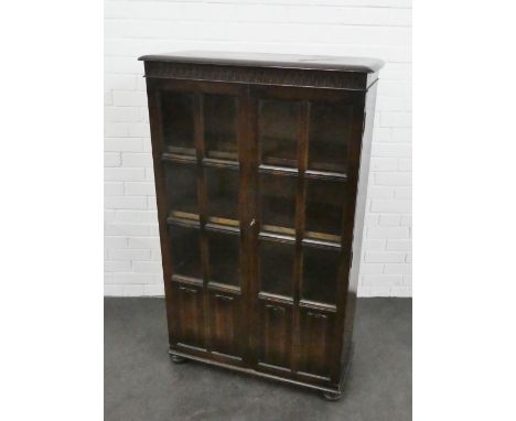 Ercol bookcase cabinet with a pair of glazed cupboard doors, 132 x 81cm