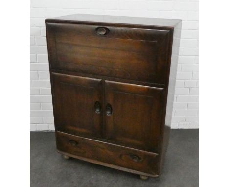 Ercol dark elm cabinet with a fall front over pair of cupboard doors and single long drawer to the base,  110 x 83cm