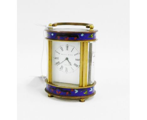 A small oval brass and cloisonne carriage clock, the enamel dial with Roman numerals and  inscribed Elliot & Son, London, 9cm