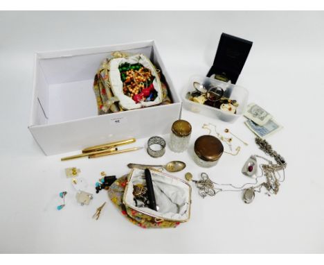 A carton containing costume jewellery, silver topped trinket jars, 1966 £5 note, etc (a lot) 