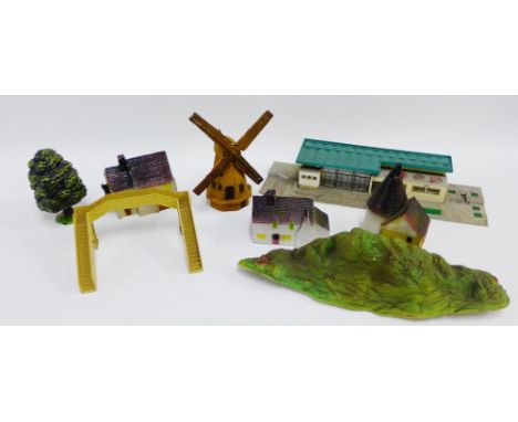 A large lot of vintage scenery to accompany a train set to include a variety of village and industrial buildings, station and
