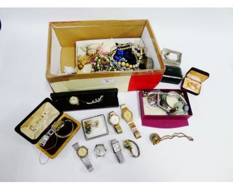 A carton containing a collection of vintage and later costume jewellery and wristwatches (a lot) 