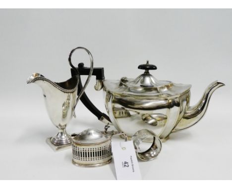 A mixed lot to include a London silver napkin ring, Chester silver salt (liner lacking) Epns jug and teapot (4) 