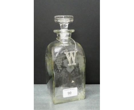 19th century fruit and vine etched decanter and stopper, 22cm tall, together with a white metal whisky decanter label, (2) 