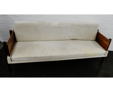 A hand crafted Mid century teak framed sofa, with loose cushions  64 x 198cm 