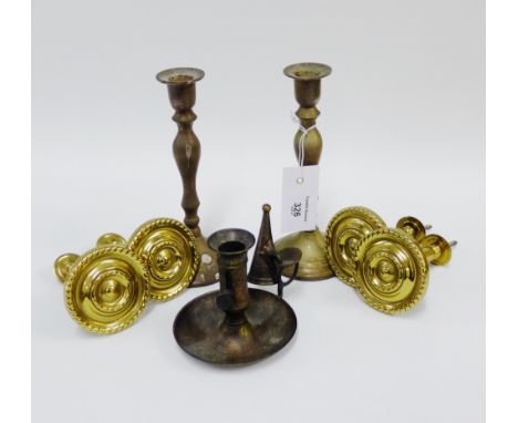 Brass wares to include door handles, pair candlesticks and a chamber stick, (7)