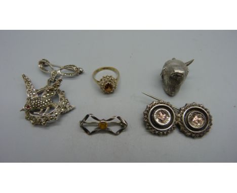 A Victorian silver bulls head fob set with with bloodstone, a/f, lacking one horn, three brooches and a silver ring, K 