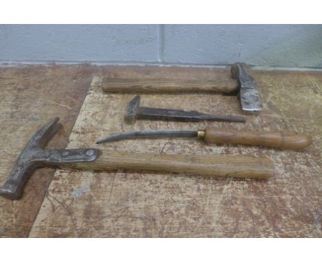 Four saddlers tools, early 20th Century and one mid 20th Century marked 1952 and with broad arrow 