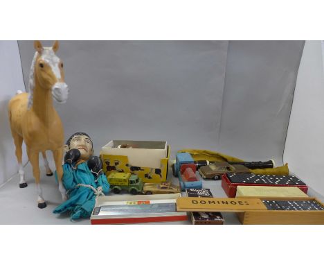 A collection of vintage toys; cased dominoes, boxer puppet, Pelham Puppet Bengo, mouth organ, die-cast model vehicles, etc. 