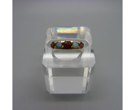 A 9ct gold, opal and garnet ring, 2.2g, N 