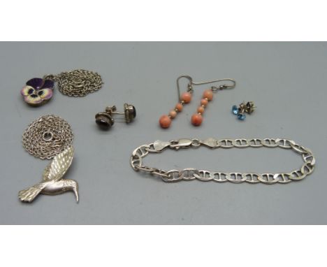 A silver and enamel locket, enamel chipped, a silver  bracelet, three pairs of earrings and a silver bird pendant 