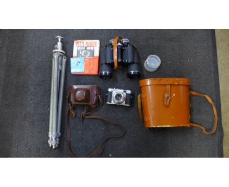 Vintage photography equipment including tripod, Voightlander camera and manual and a pair of Prinzlux 10x50 binoculars, cased