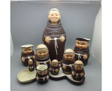 A collection of Goebel monks items including a decanter, jugs and cruet set 