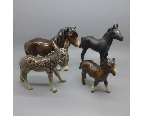 Three Beswick foals and a Goebel donkey 