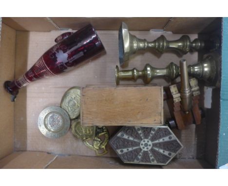 A pair of Victorian brass candlesticks, a ruby flash cut decanter, two wooden boxes, a copper model cannon and other brass 