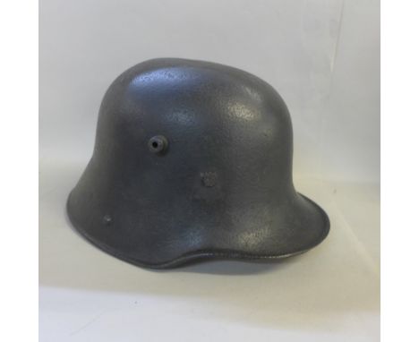 A WWI Infantry helmet with original liner 
