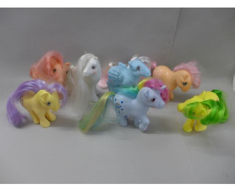 Seven original My Little Pony:- Peaches, Lemon Drop, Wind Whistler, Cherries Jubilee, Magic Star, Moonstone and Bride Beauty