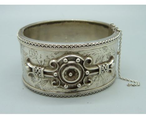 A Victorian James Fenton silver bangle, Birmingham 1882, 31mm wide, some dents, 50mm x 54mm opening 