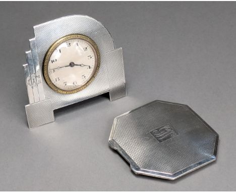 An Art Deco timepiece in engine-turned silver frame, 9.2cm high x 8.6cm wide, Birmingham 1936; and an octagonal engine-turned