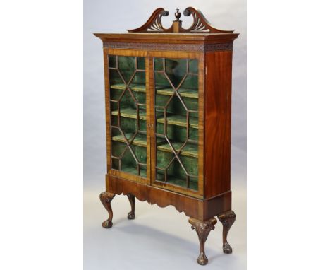A 19th century Chippendale-style mahogany display cabinet enclosed pair of astragal glazed doors, on carved cabriole legs wit