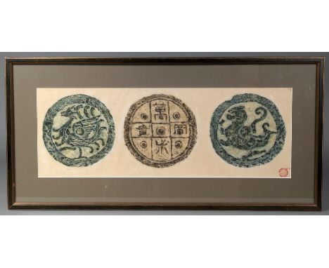 A Chinese rubbing of three archaic roundels, with red seal lower right, 19cm x 54.5cm, framed &amp; glazed (33 x 68cm overall