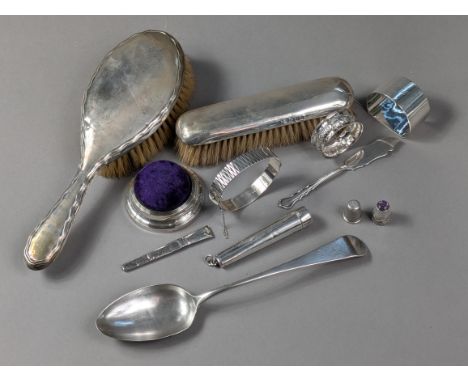 A George III Silver Old English tablespoon, Exeter 1803, by Wm. Welch II; a silver-mounted pincushion; a silver stiff hinged 