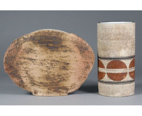 A Troika pottery cylindrical vase of textured buff ground, with band of circles within dark brown line borders, decorator’s m