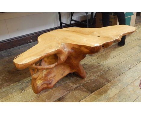 Modern coffee table made from a shaped tree trunk, with carved detail, 114cm wide 