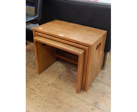 Early 20th century rectangular, Ercol style, nest of three tables with integral handles to sides, the largest 50.5cm x 30.5cm