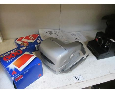 2 Polaroid cameras and films