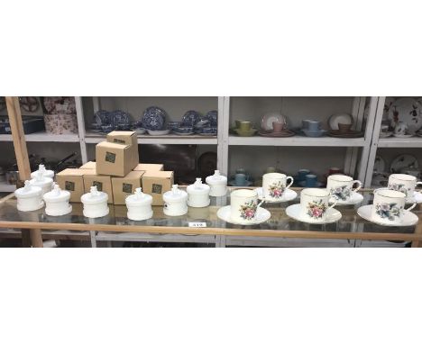 A set of 6 Royal Worcester coffee cups and saucers together with 9 boxed Russ trinket boxes.