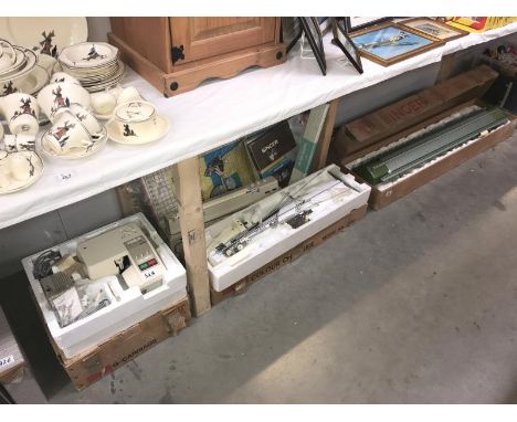 A boxed vintage Singer knitter machine, one other (unboxed a/f), colour charger, an Empisal knitmaster, Brother G carriage et